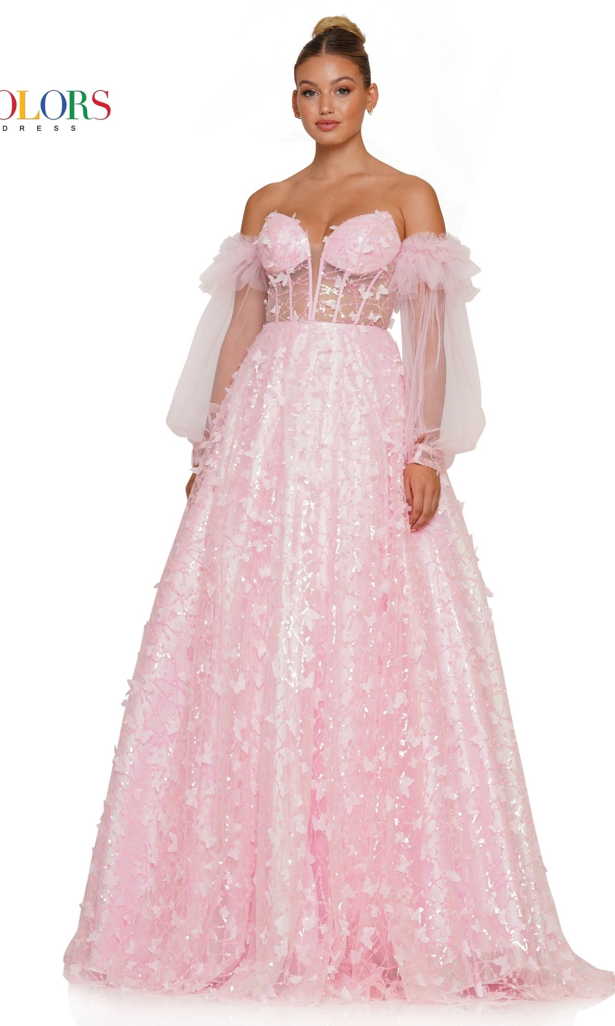 A woman wears the 3D Butterfly Formal Ball Gown 3226 with Sleeves, featuring a light pink off-the-shoulder design, removable sheer puff sleeves, a fitted bodice, and a full sequin-embellished skirt.